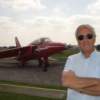 Nigel Champness ex Red Arrows, beside a Red Arrow aircraft wearing his Bigatmo's.