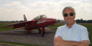 Nigel Champness ex Red Arrows pilot, beside a Red Arrow aircraft wearing his Bigatmo's.