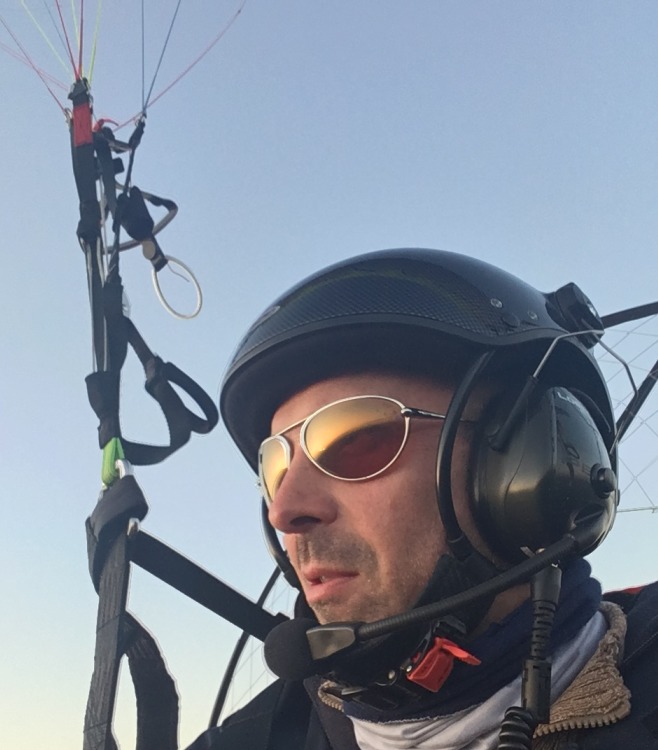 Man wearing Bigatmo sunglasses whilst power paragliding